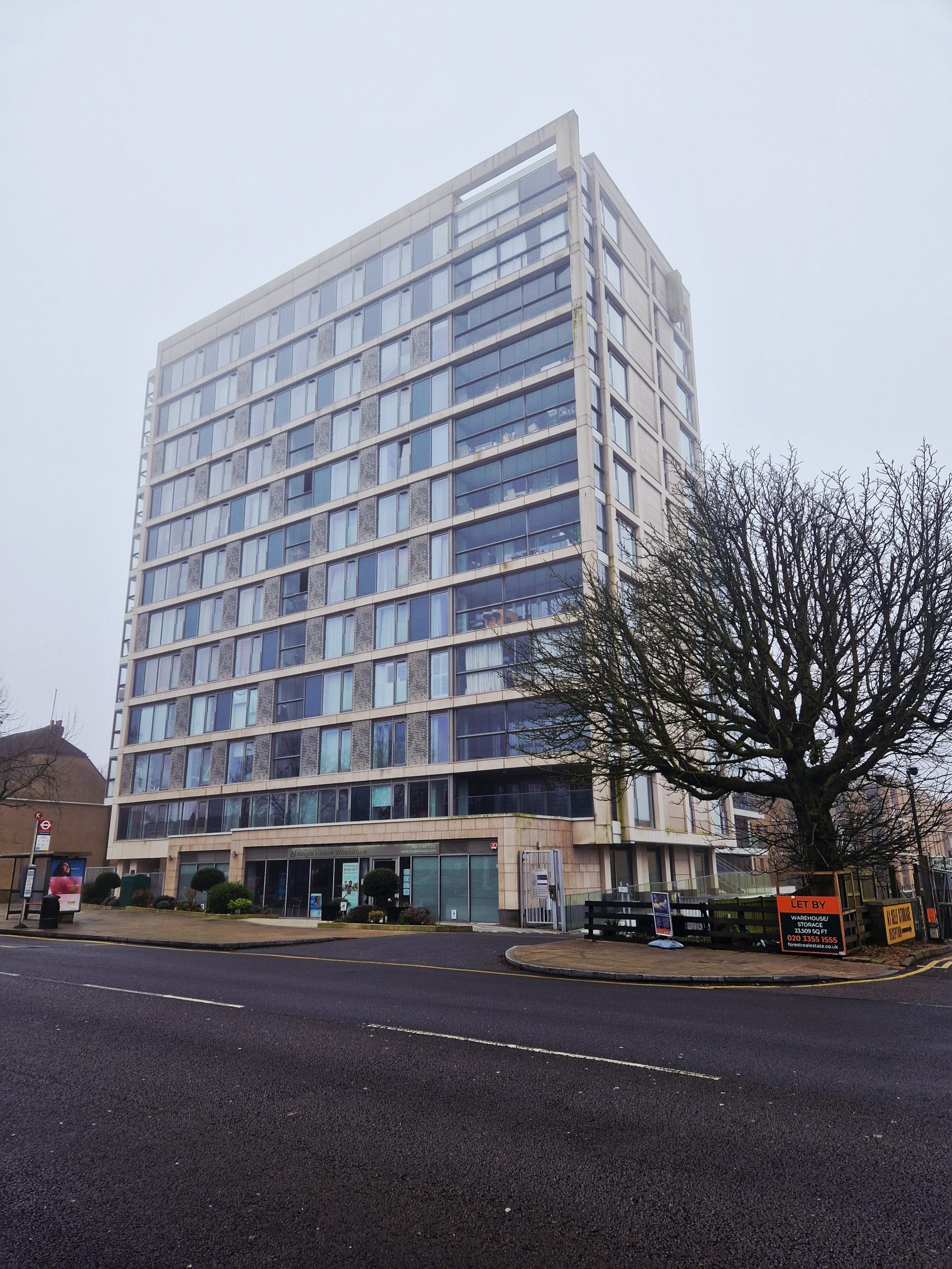 A panoramic view of the London skyline with distinctive housing developments visible.