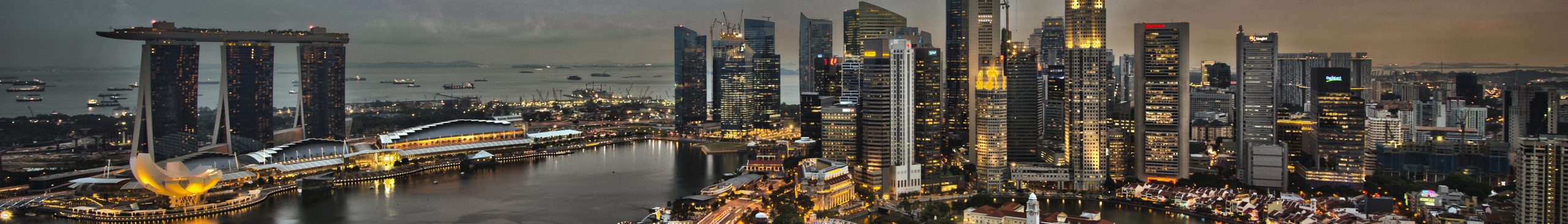 A panoramic view of a modern city skyline at dusk, illustrating the complex urban environment where diverse policies are enacted.