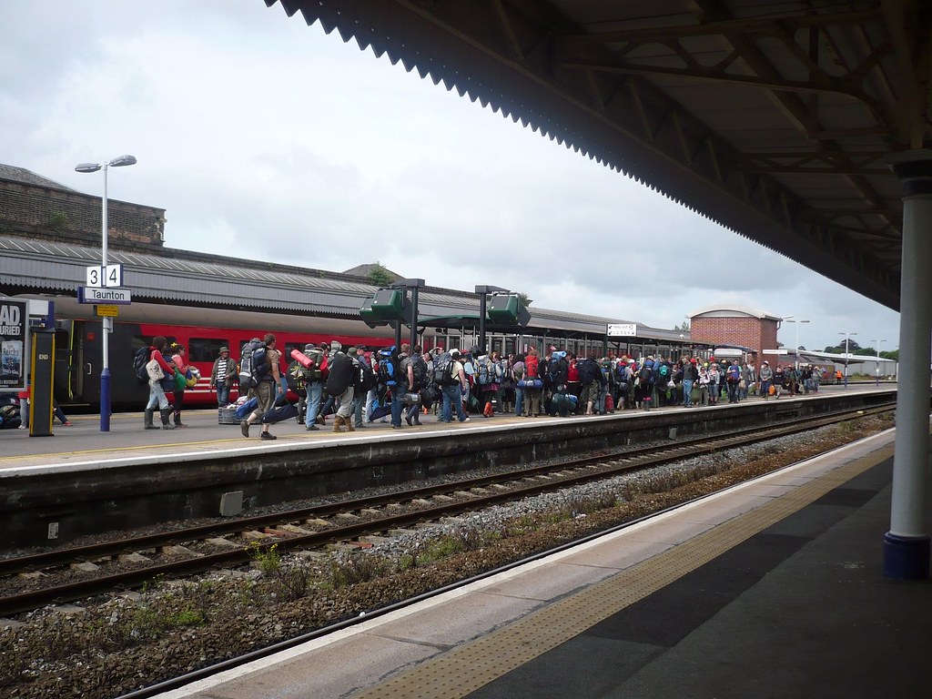 A busy London Underground station with passengers