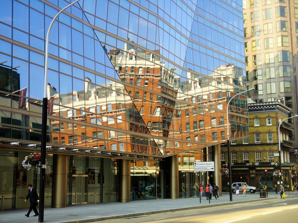 A busy London Underground station platform with a train arriving, illustrating urban transport infrastructure.