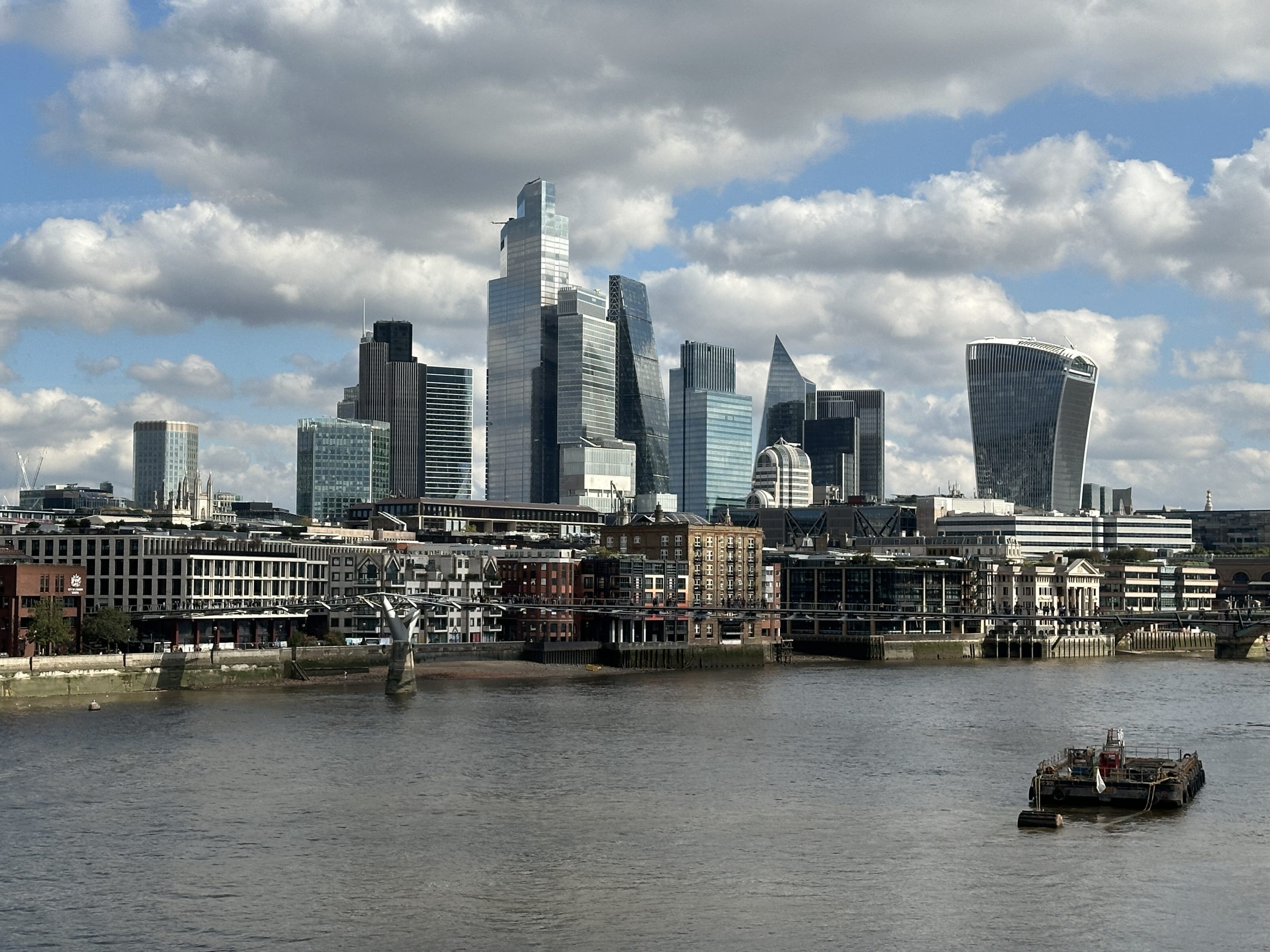 Construction cranes over London skyline with new housing developments
