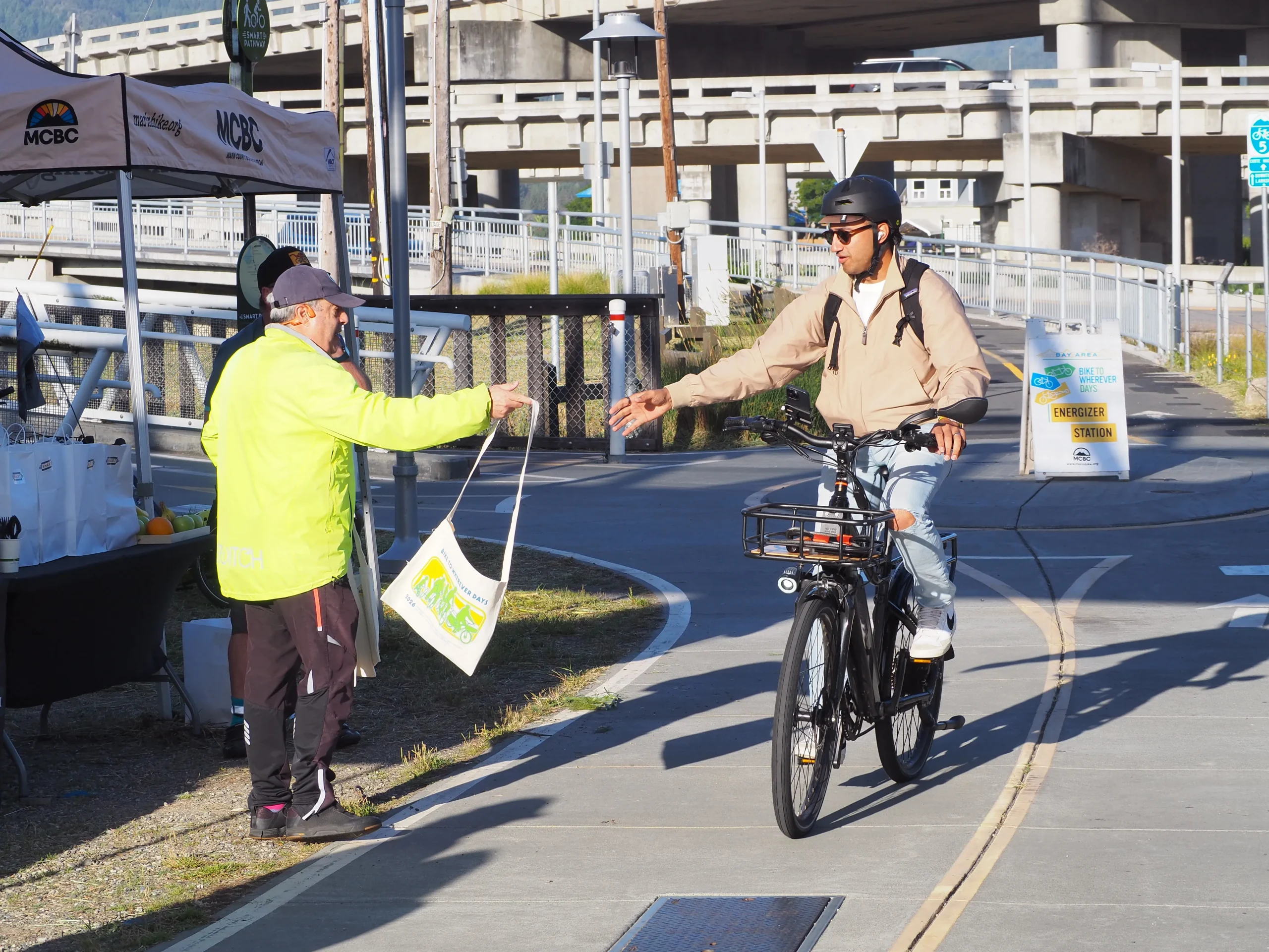 Cyclists using a protected bike lane, a common sight in urban areas promoting active travel.