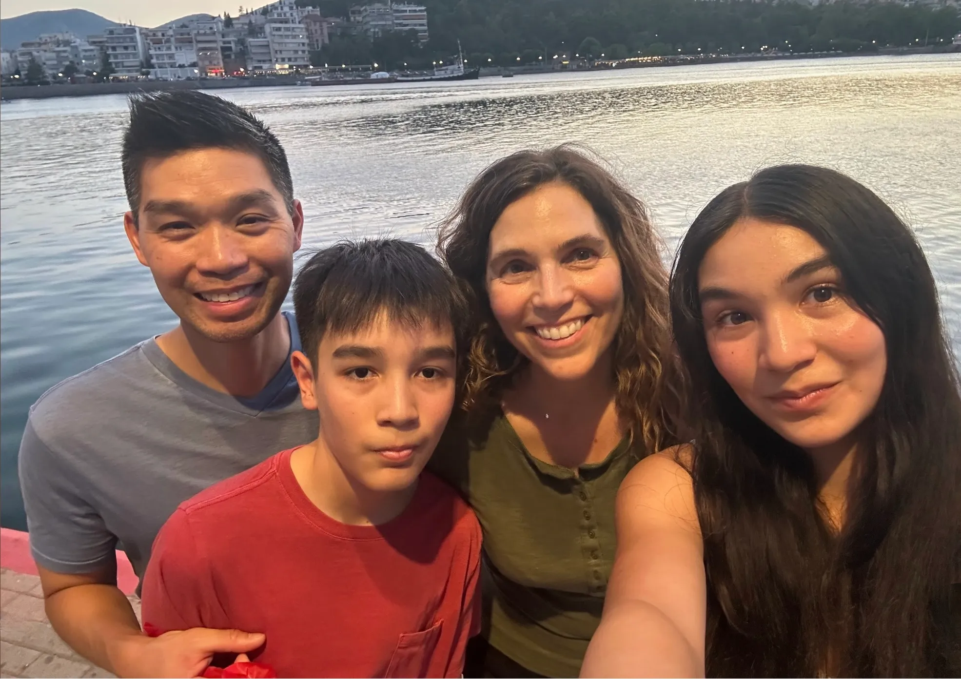 Dr. Ray Lee's wife and children stand with participants of the Chicago Ride of Silence at the intersection where he was injured.