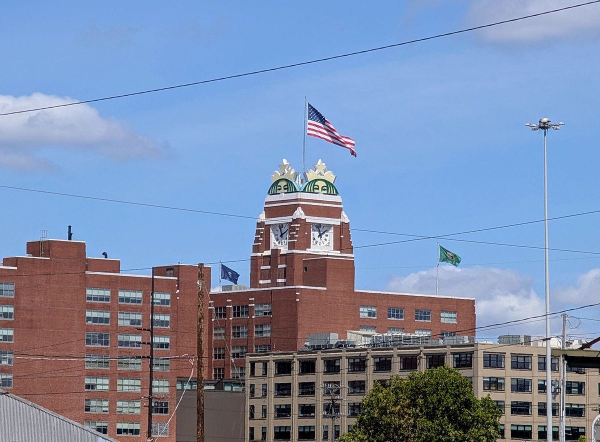 Contrasting skylines of Nashville, Tennessee and Seattle, Washington, representing diverging corporate and social landscapes.
