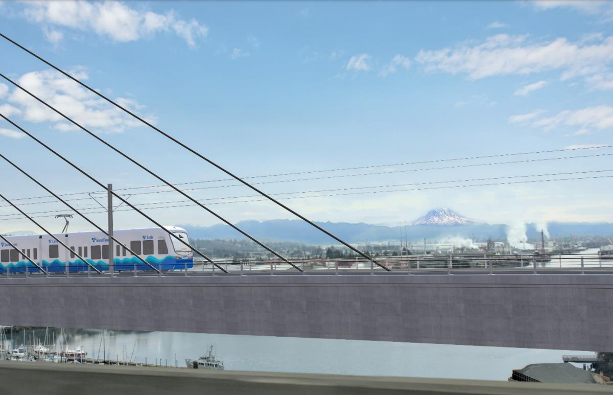 Construction site for a light rail extension in Seattle, with heavy machinery and infrastructure development visible.