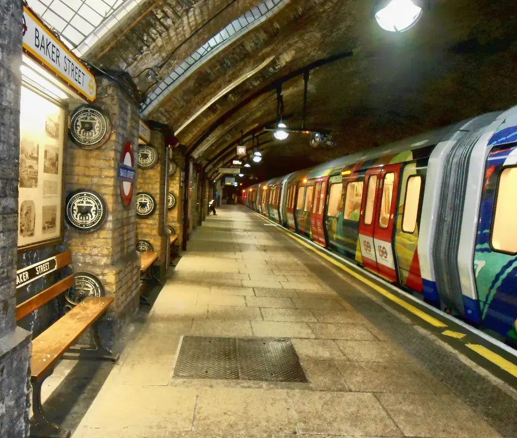 London Underground station platform with a train arriving