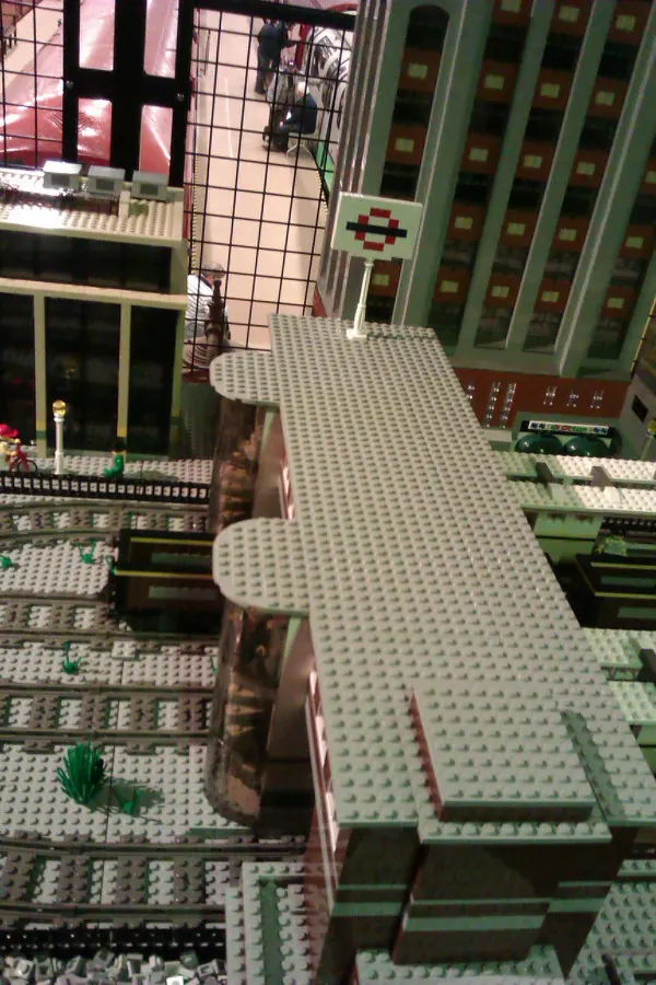 A futuristic depiction of London's public transport system, with sleek trains and integrated mobility options.