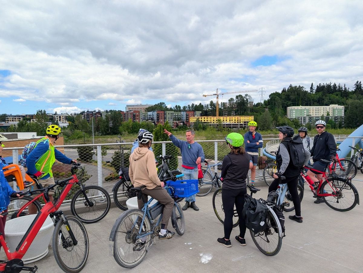 A diverse group of people engaging in a discussion at a community event.