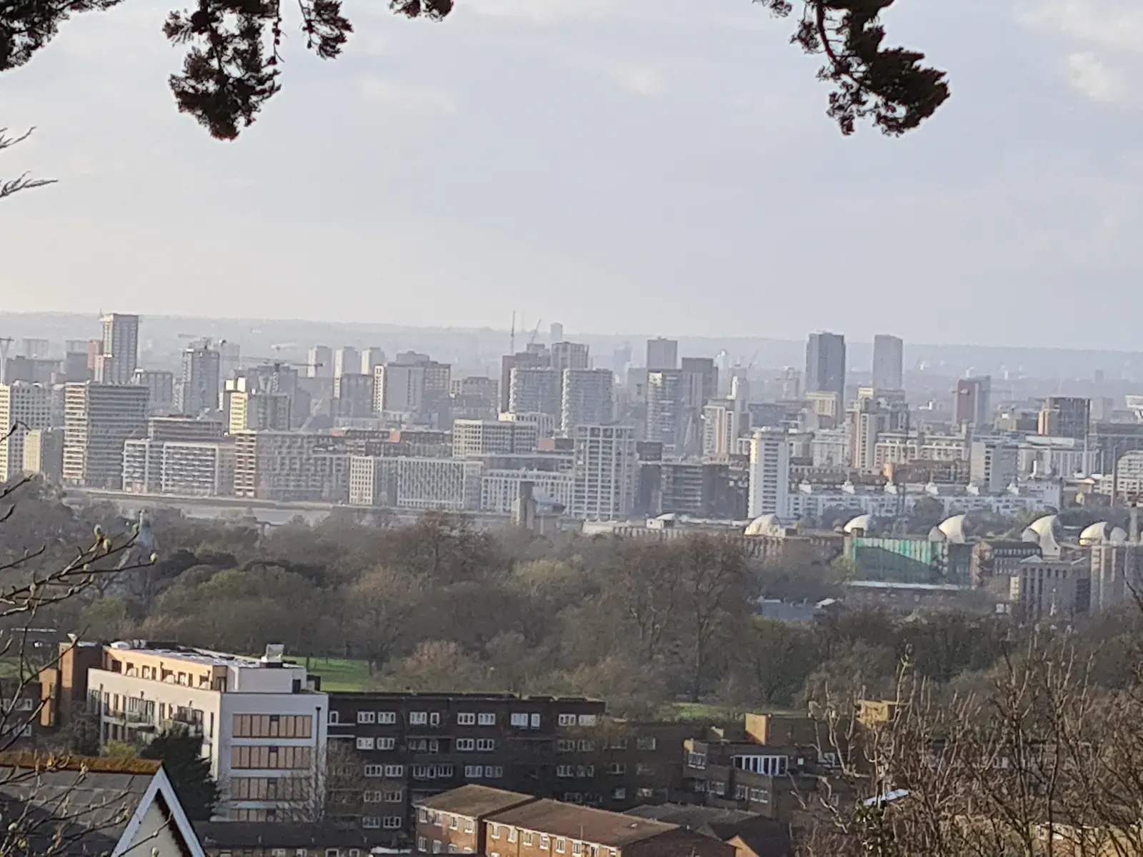 A panoramic view of the London skyline with a mix of historic and modern skyscrapers.