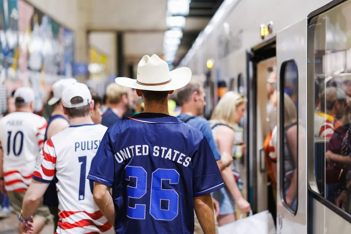 A crowded Seattle light rail station with passengers boarding a train during a major event.