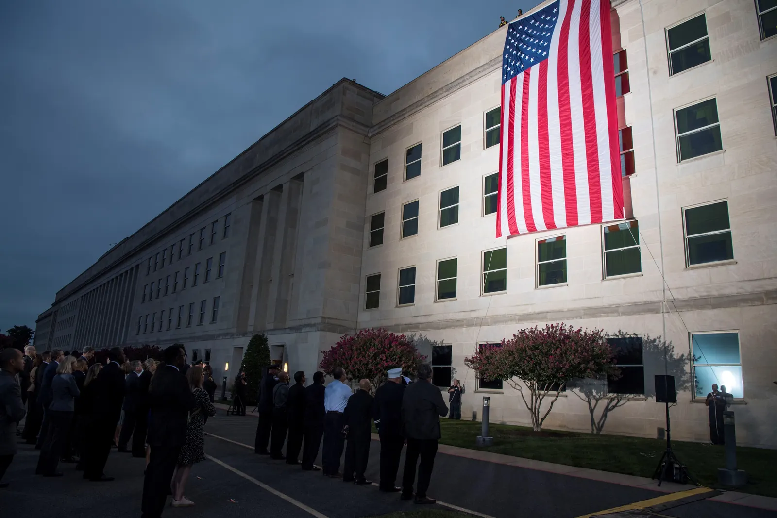 Exterior of a federal building with an American flag displayed.