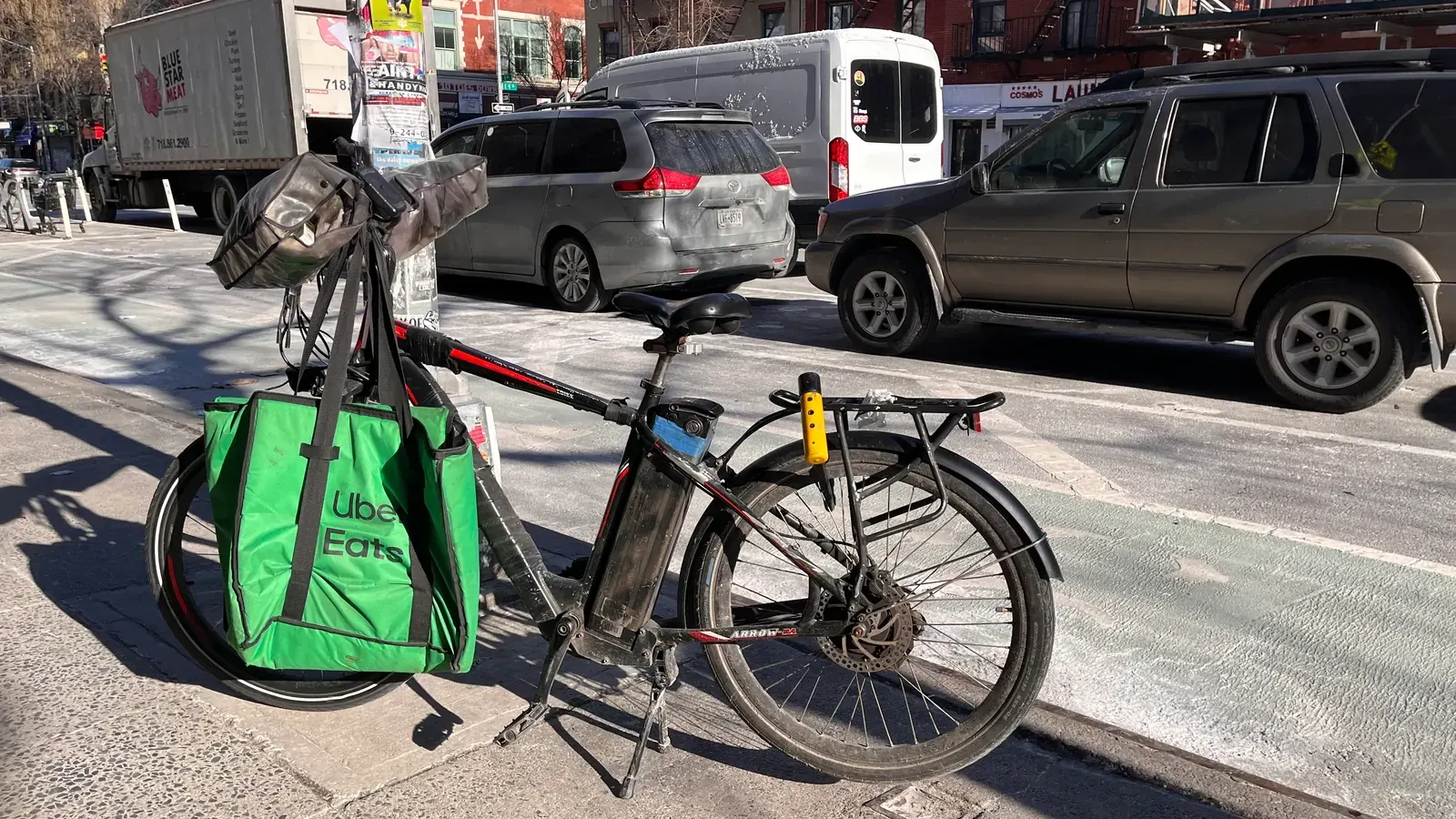 A delivery worker on a bicycle in London, illustrating the gig economy
