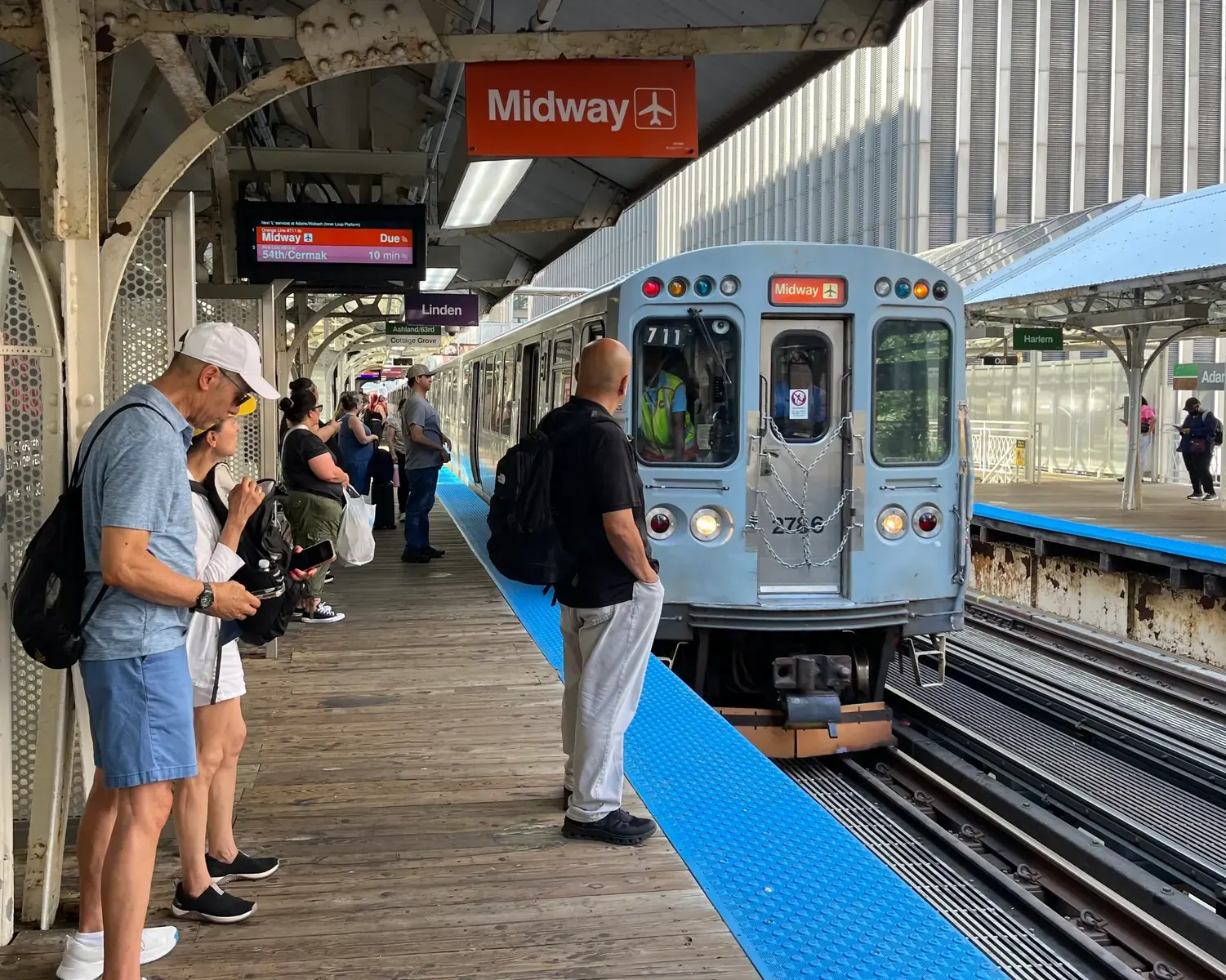 A street view of Chicago with cyclists and public transit visible, representing the focus of Streetsblog Chicago's reporting.