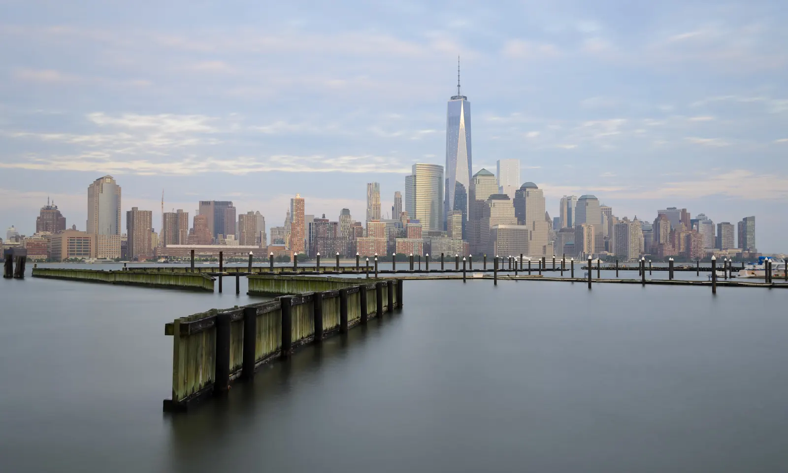 Skyline view of Jersey City with skyscrapers and waterfront buildings.