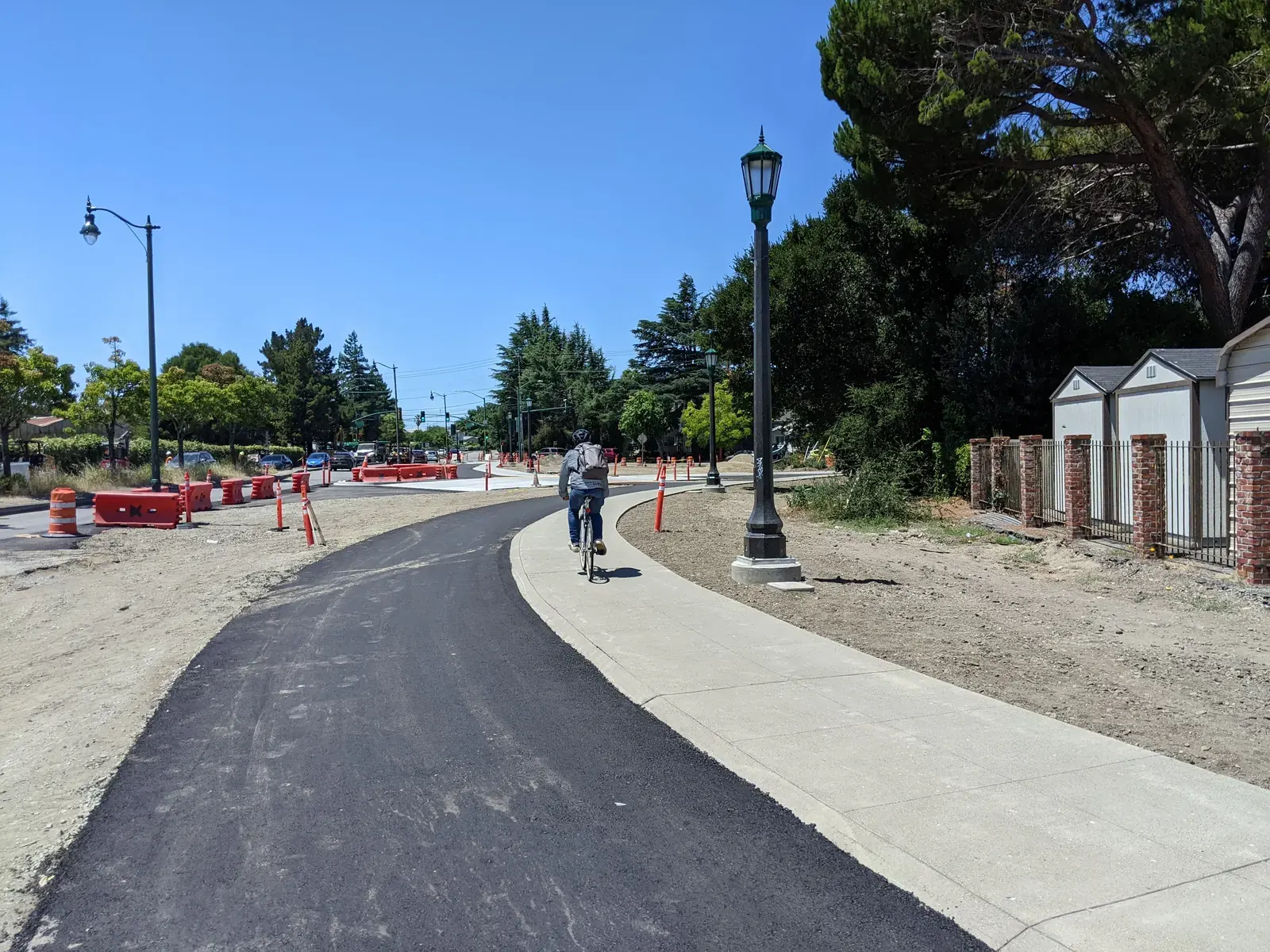 Cyclists and pedestrians using a new protected bike lane near the Fruitvale Bridge in Alameda.