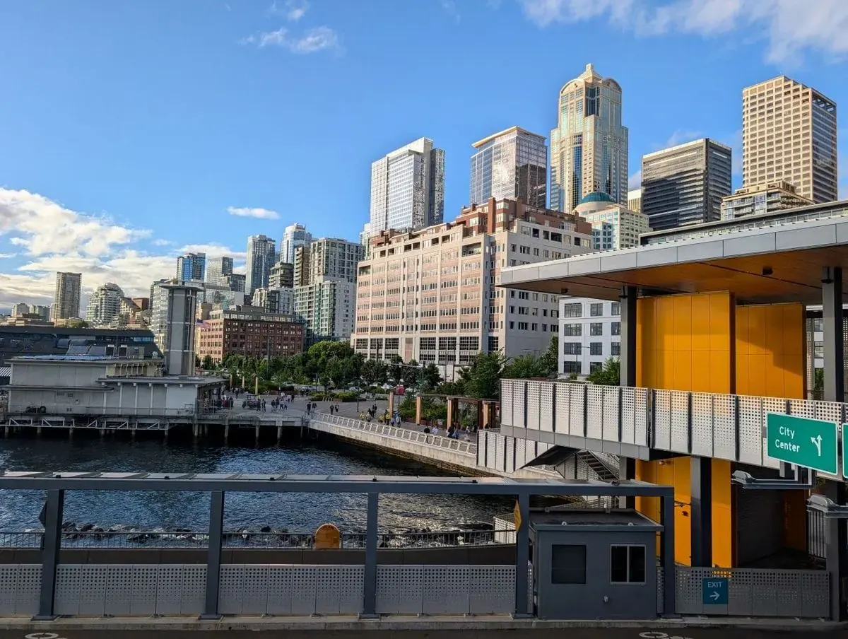 Panoramic view of the Seattle skyline with Puget Sound in the foreground.