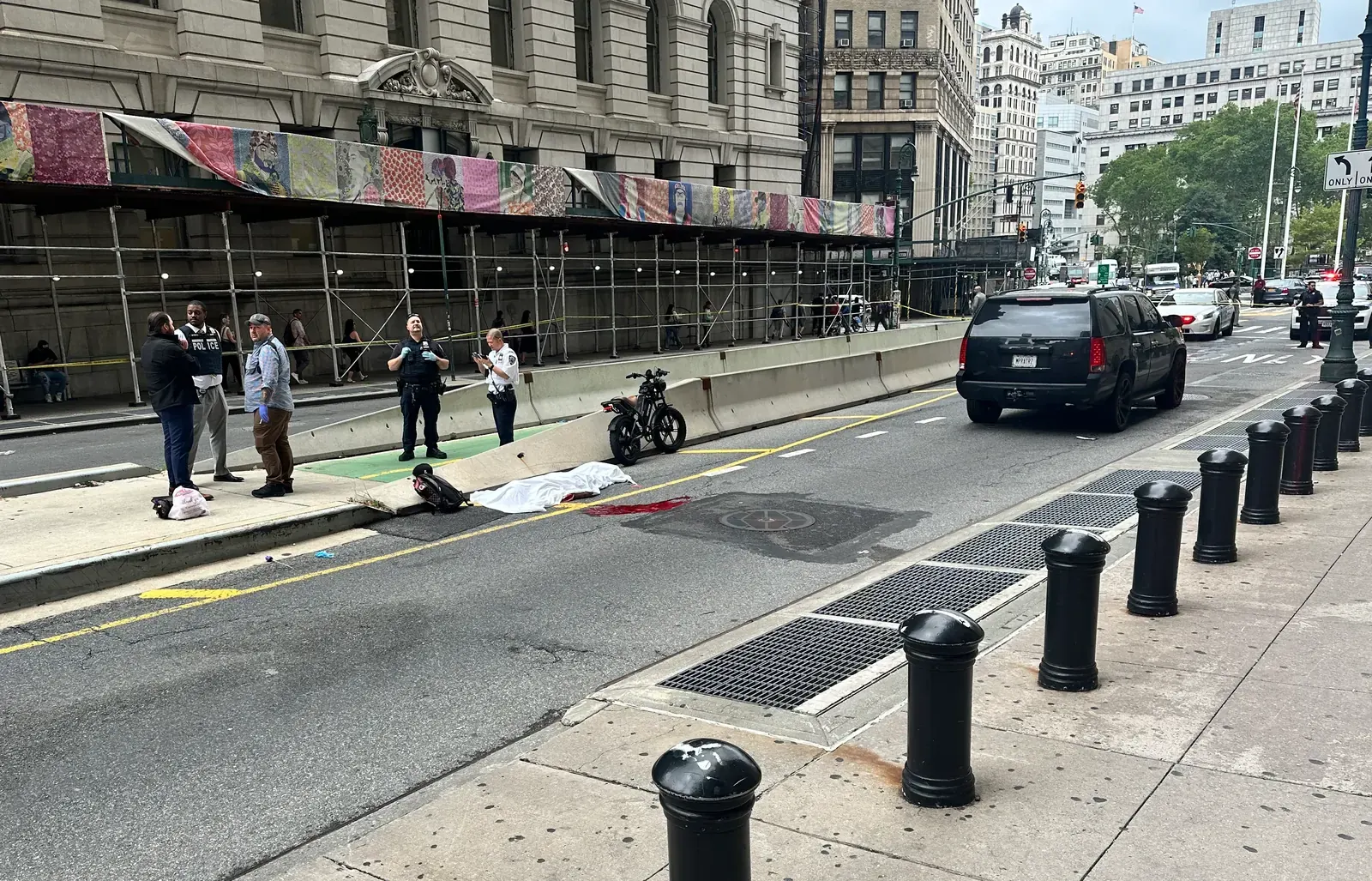 An illegal e-moto with a large motor parked on a London street, next to a bicycle lane, illustrating the growing problem of overpowered electric bikes