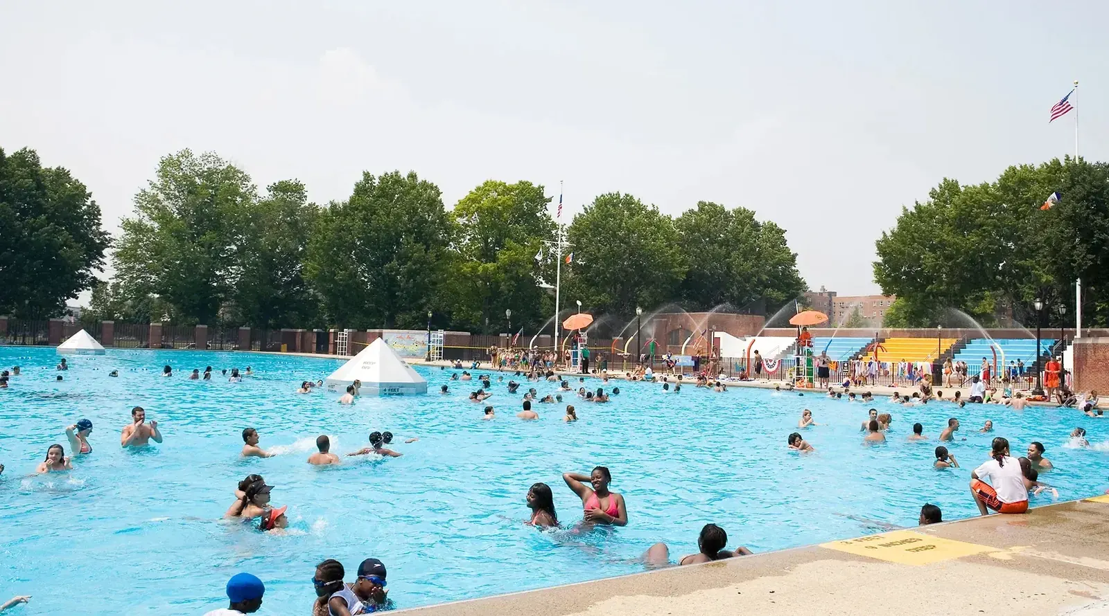 The Red Hook Pool in Brooklyn, New York City, with its surrounding urban landscape.